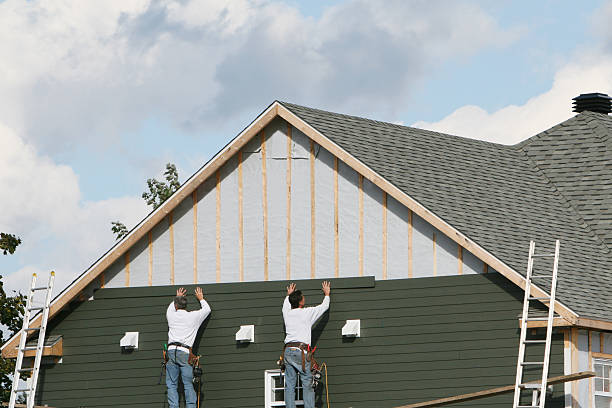 Professional Storm Damage Siding Repair technician working in Nashville, IN